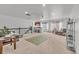 Spacious bonus room with natural light, neutral carpet, and kitchenette, ideal for Gathering gatherings and entertaining at 1385 Candleglow St, Castle Rock, CO 80109