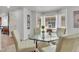 Bright dining area with glass table and bay window offering plenty of natural light at 1385 Candleglow St, Castle Rock, CO 80109