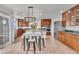 Spacious kitchen with stainless steel appliances, center island, wood cabinets, and a breakfast nook area at 1385 Candleglow St, Castle Rock, CO 80109