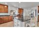 Well-lit kitchen featuring stainless steel appliances, granite counters, and ample cabinet space at 1385 Candleglow St, Castle Rock, CO 80109