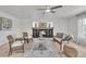 Bright living room with a fireplace, comfortable seating, natural light, and stylish decor at 1385 Candleglow St, Castle Rock, CO 80109