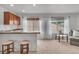 Inviting living space featuring a breakfast bar and lots of natural light at 1385 Candleglow St, Castle Rock, CO 80109