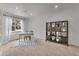 Bright office space with ample natural light, a modern desk, comfortable chair, and stylish shelving at 1385 Candleglow St, Castle Rock, CO 80109