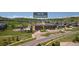 Aerial view of Clear Sky Elementary School with playground and ample parking in a neighborhood setting at 1385 Candleglow St, Castle Rock, CO 80109