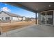 View of the backyard and other homes from covered patio at 24661 E 33Rd Dr, Aurora, CO 80019