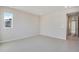 Bright, carpeted bedroom features neutral paint and a large window at 24661 E 33Rd Dr, Aurora, CO 80019