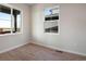 Cozy bedroom with wood floors, neutral paint, and large windows offering great natural light at 24661 E 33Rd Dr, Aurora, CO 80019