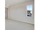 Spacious bonus room area featuring neutral carpet and window views at 24661 E 33Rd Dr, Aurora, CO 80019