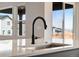 Bright kitchen with stainless steel sink, granite countertops, and modern fixtures at 24661 E 33Rd Dr, Aurora, CO 80019