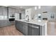 Close-up of modern kitchen island with stainless dishwasher and sink at 24661 E 33Rd Dr, Aurora, CO 80019