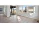 Bright living room with hardwood floors, large windows, and a sliding glass door at 24661 E 33Rd Dr, Aurora, CO 80019