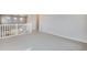 Spacious upstairs loft area with neutral carpet and white banister at 24661 E 33Rd Dr, Aurora, CO 80019