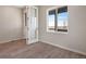 Home office with glass paneled door, wood floors, and large window with exterior views at 24661 E 33Rd Dr, Aurora, CO 80019