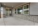 Covered patio with stone accents, providing a relaxing outdoor living space at 24661 E 33Rd Dr, Aurora, CO 80019