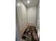 Hallway with ample storage cabinets and a geometric rug at 1469 S Reed St, Lakewood, CO 80232
