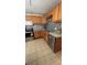 Functional kitchen featuring stainless steel appliances, and tile backsplash at 1469 S Reed St, Lakewood, CO 80232