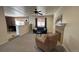 Open living room with natural light, a fireplace, and comfortable seating arrangements at 1469 S Reed St, Lakewood, CO 80232