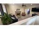 Comfortable living room with a fireplace, sofa, armchair, and lots of space at 1469 S Reed St, Lakewood, CO 80232