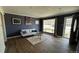 Inviting living room featuring wood floors, a comfortable couch and natural light at 1469 S Reed St, Lakewood, CO 80232