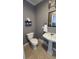 Traditional powder room with pedestal sink and stylish decor at 1469 S Reed St, Lakewood, CO 80232