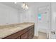 Modern bathroom featuring double vanity with granite countertops and stylish lighting at 246 Mohawk Cir, Superior, CO 80027