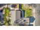 Aerial view of a well-maintained property with manicured lawns, mature trees, and a backyard shed at 2707 S Richfield St, Aurora, CO 80013