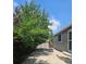 Backyard patio with concrete and mature shade trees and a metal firepit at 2707 S Richfield St, Aurora, CO 80013