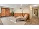 Finished basement featuring wood paneled walls, plush chaise lounge and recessed lighting at 2707 S Richfield St, Aurora, CO 80013