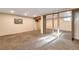 Spacious basement with carpeted floors and ample closet space, perfect for recreation and storage at 2707 S Richfield St, Aurora, CO 80013