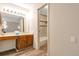Bright bathroom featuring a wood vanity with a cultured marble top and tiled shower/tub at 2707 S Richfield St, Aurora, CO 80013