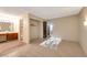 Open bedroom with en-suite bathroom vanity and bright natural lighting at 2707 S Richfield St, Aurora, CO 80013