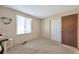 Cozy bedroom with carpet flooring, a bright window, and closet at 2707 S Richfield St, Aurora, CO 80013