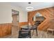 Dining area with wood paneled accent wall, unique mirror feature and modern lighting at 2707 S Richfield St, Aurora, CO 80013
