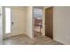 Entryway features sleek tile flooring, a glass-paneled front door, and views of the living area at 2707 S Richfield St, Aurora, CO 80013