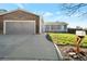 Charming single-story home with a brick attached garage, large driveway, and inviting curb appeal at 2707 S Richfield St, Aurora, CO 80013