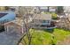 Landscaped front yard with a charming single-story home and attached garage at 2707 S Richfield St, Aurora, CO 80013
