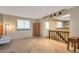 Open living area featuring neutral walls, recessed lighting and stairs to another level at 2707 S Richfield St, Aurora, CO 80013