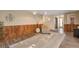 Cozy living room with a statement wood paneled wall, stylish lighting, and comfortable seating at 2707 S Richfield St, Aurora, CO 80013