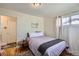 Comfortable bedroom featuring a double bed, wood floors, and bright natural light at 433 S Xavier St, Denver, CO 80219