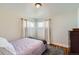 Cozy bedroom featuring a neutral palette, soft natural light, and a comfortable double bed at 433 S Xavier St, Denver, CO 80219