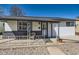 Inviting front porch with seating, decorative railings, and a cozy, welcoming entrance at 433 S Xavier St, Denver, CO 80219