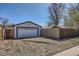 Exterior view of the detached one-car garage with an automatic door at 433 S Xavier St, Denver, CO 80219