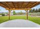 Lush backyard with a pergola, a wooden shed, and a well-manicured lawn at 6147 Dunraven St, Golden, CO 80403