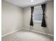 Bedroom with plush carpeting, window and dark curtains, cozy ambiance at 6147 Dunraven St, Golden, CO 80403