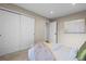 Comfortable bedroom with ample closet space, neutral walls, and plenty of natural light at 6147 Dunraven St, Golden, CO 80403