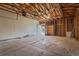 Spacious unfinished garage featuring unfinished walls and concrete floor at 6147 Dunraven St, Golden, CO 80403