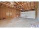 Spacious unfinished garage featuring unfinished walls and concrete floor at 6147 Dunraven St, Golden, CO 80403
