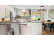 Bright, open kitchen and dining area with modern appliances and ample counter space at 6147 Dunraven St, Golden, CO 80403