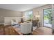 Cozy living room with wood floors, modern furniture, and a large window that allows ample sunlight at 6147 Dunraven St, Golden, CO 80403