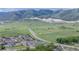 Scenic view of neighborhood and homes with mountains in the background and green valley at 6147 Dunraven St, Golden, CO 80403
